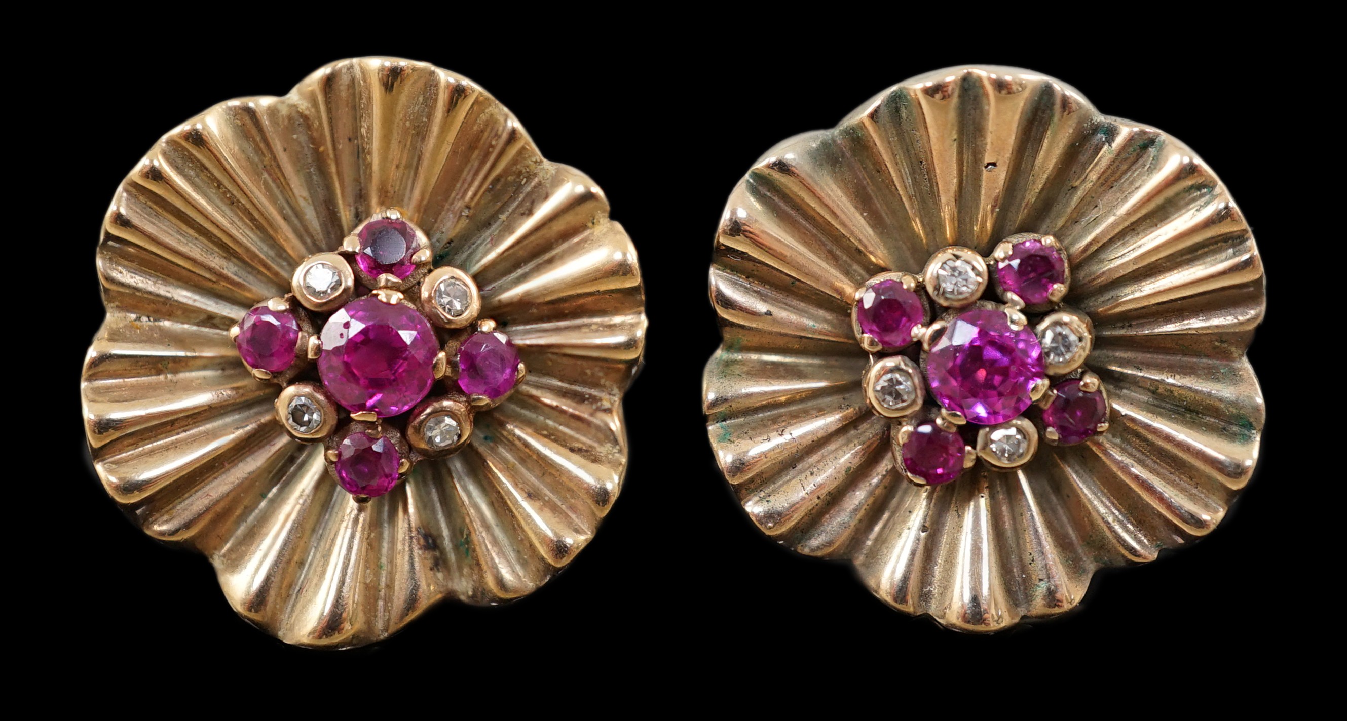 A pair of 1950's gold?, ruby and diamond cluster set flower head earrings